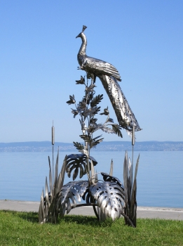 Peacock on tree garden sculpture rusty